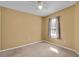 Empty bedroom with a ceiling fan, window with curtains, and neutral carpet at 2288 Leland Ln, Casselberry, FL 32707