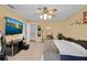 Spacious bedroom with ceiling fan, mounted TV, and neutral carpet at 2288 Leland Ln, Casselberry, FL 32707