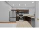 Spacious kitchen with modern stainless steel appliances and dark wood cabinets at 2288 Leland Ln, Casselberry, FL 32707