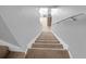 A view of the carpeted stairs leading to the second floor of the home at 2288 Leland Ln, Casselberry, FL 32707