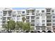 Attractive apartment building featuring multiple floors, balconies, and well-maintained landscaping at 2305 Edgewater Dr # 1604, Orlando, FL 32804