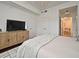 Comfortable bedroom with a cozy bed, modern furniture, and access to a view of the ensuite bathroom at 2305 Edgewater Dr # 1604, Orlando, FL 32804