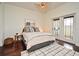 Cozy bedroom with comfortable bed, balcony access, and stylish decor, perfect for relaxation at 2305 Edgewater Dr # 1604, Orlando, FL 32804