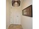 Clean entryway with stylish light fixture and modern artwork, creating a welcoming ambiance at 2305 Edgewater Dr # 1604, Orlando, FL 32804