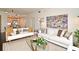 Cozy living room with hardwood floors, comfortable seating, and a view into the open kitchen space at 2305 Edgewater Dr # 1604, Orlando, FL 32804