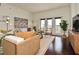 Bright living room with balcony access, stylish decor, and ample natural light at 2305 Edgewater Dr # 1604, Orlando, FL 32804