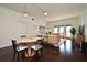 Stylish living area with hardwood floors, modern lighting, and balcony access, perfect for entertaining at 2305 Edgewater Dr # 1604, Orlando, FL 32804