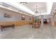 Grand lobby area featuring decorative lighting, wood paneling, ample seating, and elegant decor at 2305 Edgewater Dr # 1604, Orlando, FL 32804