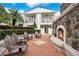 Cozy outdoor fireplace with stone surround, surrounded by seating and lush landscaping, perfect for gatherings at 2305 Edgewater Dr # 1604, Orlando, FL 32804