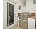 A convenient outdoor kitchen with stainless steel grill, prep space, and storage, perfect for alfresco dining at 2305 Edgewater Dr # 1604, Orlando, FL 32804