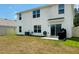 Spacious backyard with lush grass and a patio, perfect for outdoor entertaining at 239 Se 66Th Ct, Ocala, FL 34472