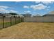Large backyard enclosed with both iron and white privacy fencing at 239 Se 66Th Ct, Ocala, FL 34472