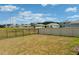 Expansive fenced backyard with open views and plenty of space for recreation at 239 Se 66Th Ct, Ocala, FL 34472