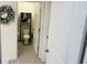 Small powder room with toilet and decorative shelving at 239 Se 66Th Ct, Ocala, FL 34472