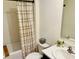 Cozy bathroom featuring shower with curtain, toilet and sink at 239 Se 66Th Ct, Ocala, FL 34472