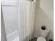 Bathroom featuring a shower with a white shower curtain and neutral decor at 239 Se 66Th Ct, Ocala, FL 34472