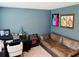 Office/bedroom featuring a sofa and sports-themed decor at 239 Se 66Th Ct, Ocala, FL 34472