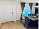 Welcoming foyer featuring hardwood flooring, a front door, and a view into dining area at 239 Se 66Th Ct, Ocala, FL 34472