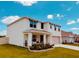 Charming two-story home with a welcoming front porch and well-manicured landscaping at 239 Se 66Th Ct, Ocala, FL 34472