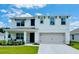 Charming two-story home with a well-manicured lawn and covered front porch at 239 Se 66Th Ct, Ocala, FL 34472