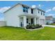 Inviting two-story home with a covered front porch and meticulously maintained yard at 239 Se 66Th Ct, Ocala, FL 34472