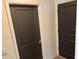 Hallway featuring a set of dark-colored doors at 239 Se 66Th Ct, Ocala, FL 34472