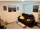 Relaxing living room with comfortable seating and entertainment-themed decor at 239 Se 66Th Ct, Ocala, FL 34472