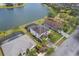 Lakeside home with a screened pool, complemented by a beautifully landscaped yard, as seen from above at 2803 Boating Blvd, Kissimmee, FL 34746