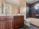 Bathroom with double sink vanity and a shower-tub combo with black tile at 2803 Boating Blvd, Kissimmee, FL 34746