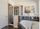 Modern bathroom featuring a glass-enclosed shower and a luxurious soaking tub at 2803 Boating Blvd, Kissimmee, FL 34746