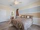 Comfortable bedroom featuring stylish bedding, a ceiling fan and neutral-toned walls at 2803 Boating Blvd, Kissimmee, FL 34746