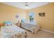 Bright bedroom with twin beds and waterfront views from a large window at 2803 Boating Blvd, Kissimmee, FL 34746