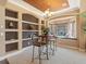 Charming dining area with a cozy bay window seat, a round table, and built-in shelving for display at 2803 Boating Blvd, Kissimmee, FL 34746