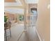 Inviting foyer with a view of the living room, staircase, and large windows offering ample natural light at 2803 Boating Blvd, Kissimmee, FL 34746