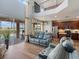 Open concept living room featuring high ceilings, a view of the upstairs balcony, and access to the pool area at 2803 Boating Blvd, Kissimmee, FL 34746