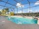 Screened-in pool with a serene view at 2803 Boating Blvd, Kissimmee, FL 34746