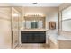 Bathroom with a double sink vanity, tiled floors, a shower, and a soaking tub at 2906 Sunset Vista Ct, Kissimmee, FL 34747