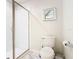 Bathroom featuring a walk-in shower, toilet, and modern tile flooring providing a clean and functional space at 303 Ocean Course Ave, Davenport, FL 33896