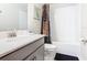 Bathroom featuring a vanity, toilet, and shower/tub combo with modern fixtures at 303 Ocean Course Ave, Davenport, FL 33896