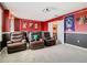 Home theater with comfortable seating, projector, and stylish decor offers a great cinematic experience at 303 Ocean Course Ave, Davenport, FL 33896