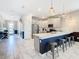 Spacious kitchen with island, pendant lighting, and modern finishes at 303 Ocean Course Ave, Davenport, FL 33896
