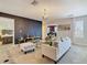 Spacious living room featuring modern chandelier, stylish decor, and comfortable seating at 303 Ocean Course Ave, Davenport, FL 33896