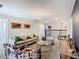 Bright living space with comfortable gray sofa, round glass table, and modern decor at 303 Ocean Course Ave, Davenport, FL 33896