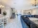 Spacious open-concept layout with kitchen, living, and dining areas at 303 Ocean Course Ave, Davenport, FL 33896