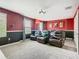 Theater room featuring reclining chairs, carpet, and projector at 303 Ocean Course Ave, Davenport, FL 33896
