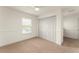Bedroom features neutral carpet, white walls, a closet, and a bright window at 3752 Cleary Way, Orlando, FL 32828