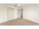 Bedroom with neutral carpet, white walls, and views into another room at 3752 Cleary Way, Orlando, FL 32828
