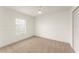 Bedroom has neutral carpet, white walls, a ceiling fan, and a bright window at 3752 Cleary Way, Orlando, FL 32828