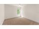 Bright bedroom offers neutral carpet, white walls, a ceiling fan, and a bright window at 3752 Cleary Way, Orlando, FL 32828