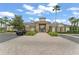 Beautiful clubhouse with stone and siding, a brick paver entry, lush landscaping, and ample parking at 3752 Cleary Way, Orlando, FL 32828